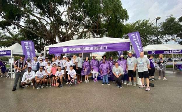 Memorial Cancer Institute PurpleStride team pictured in front of their Sponsor tent.