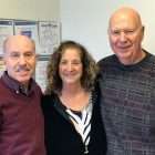 Two pancreatic cancer survivors and a caregiver in healthcare specialist’s office